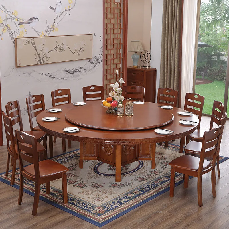 large round wooden dining table and chairs