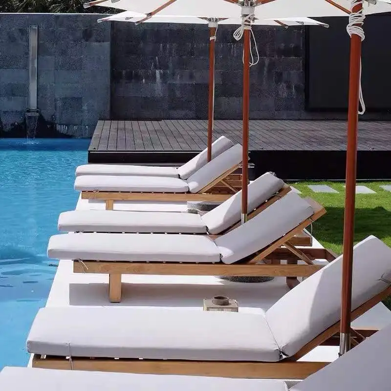 pool lounge chairs in water