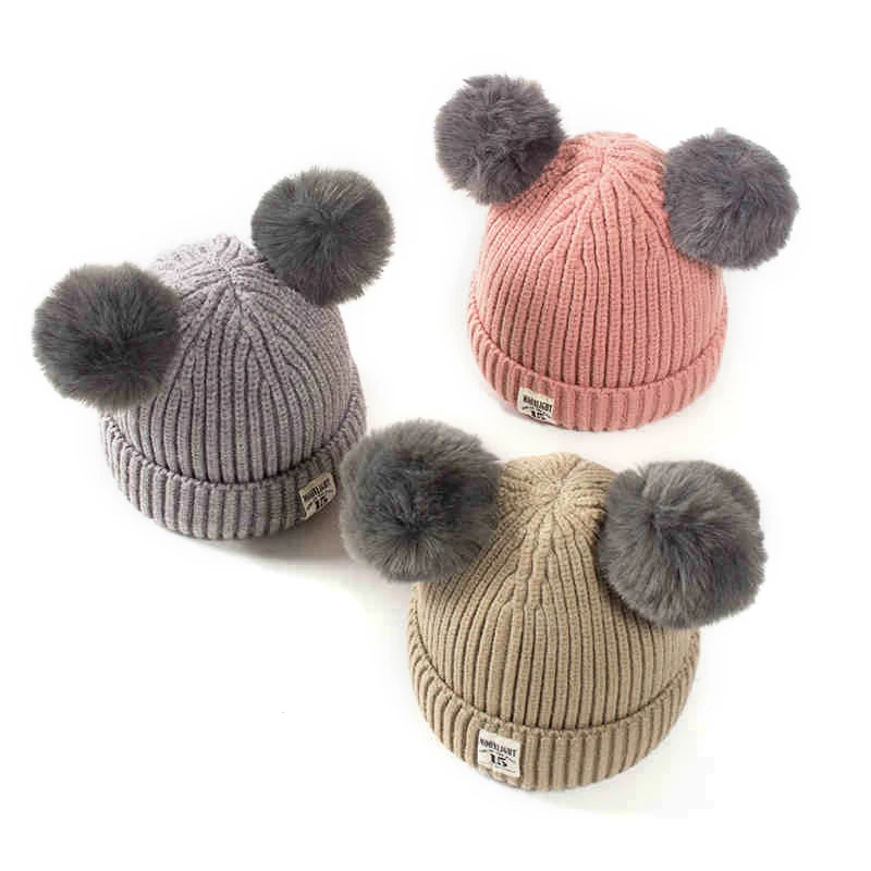 real fur double pom pom hat