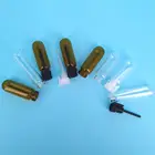 small amber and clear round bottom perfume glass sample vial