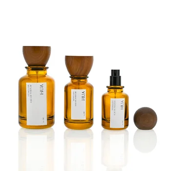 New Luxury Cylinder Shape Amber Spray Glass Bottle 30ml 50ml 100ml Cosmetic Amber Perfume Bottle with Round Wooden Lids