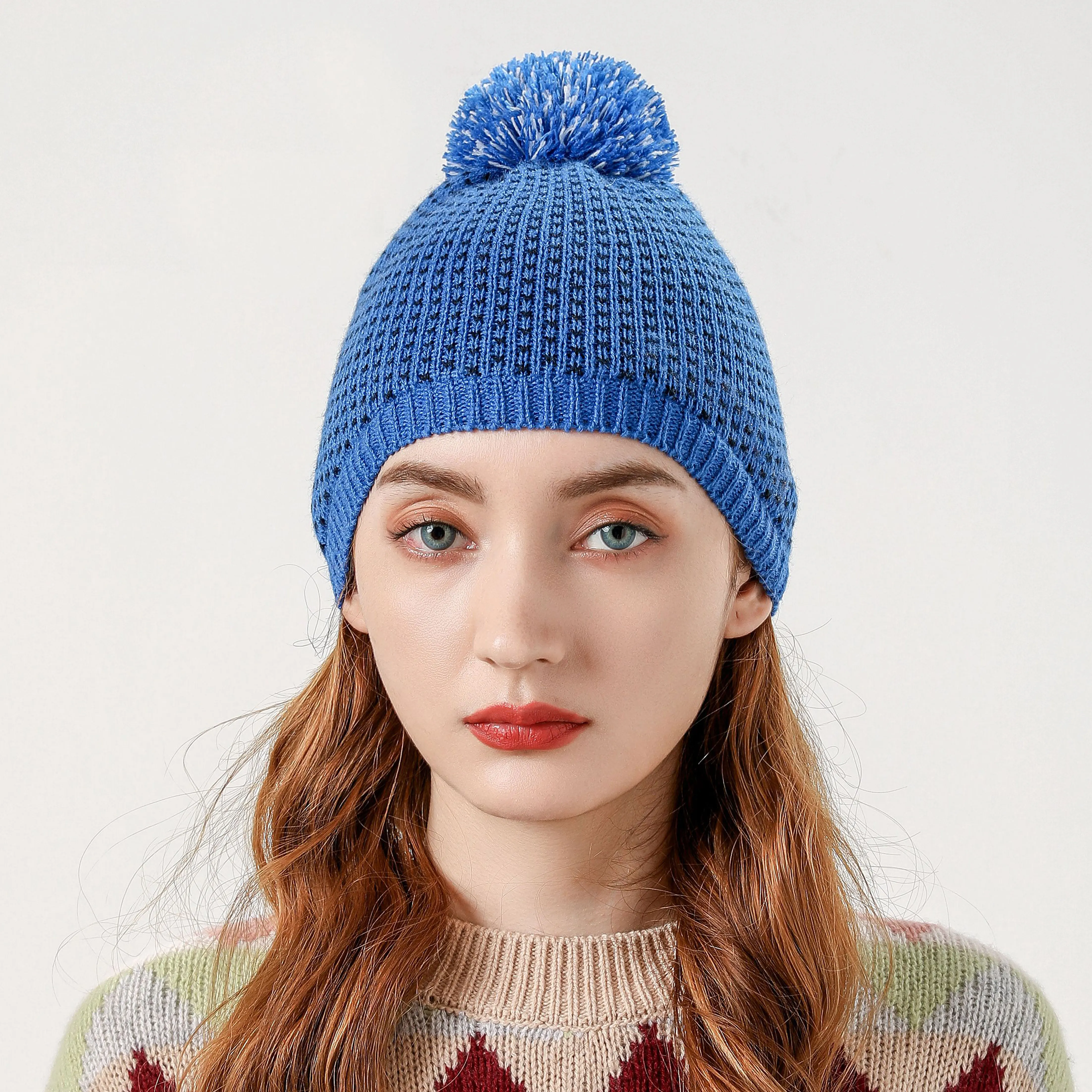 blue winter hat with pom pom