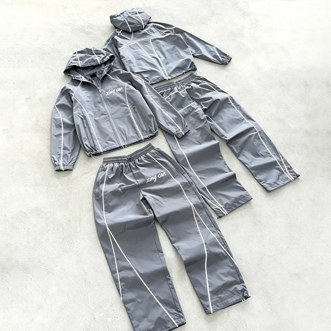 product streetwear factory custom nylon tracksuit with full reflective strips men screen print loose straight leg training suit oem-2