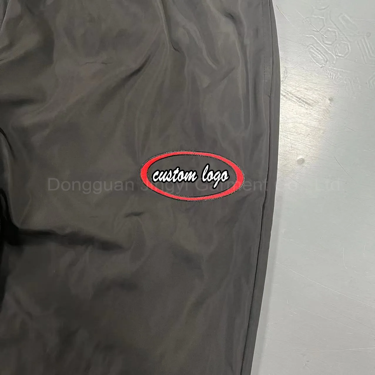 Dongguan Manufacturer Custom Casual Waterproof Outdoors Windbreaker Polyester Trousers Blank Embroidery Nylon Track Pants Men manufacture