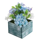 White Wooden Planters A Variety Of Artificial White And Violet Flowers Arranged In Blue Wooden Planters