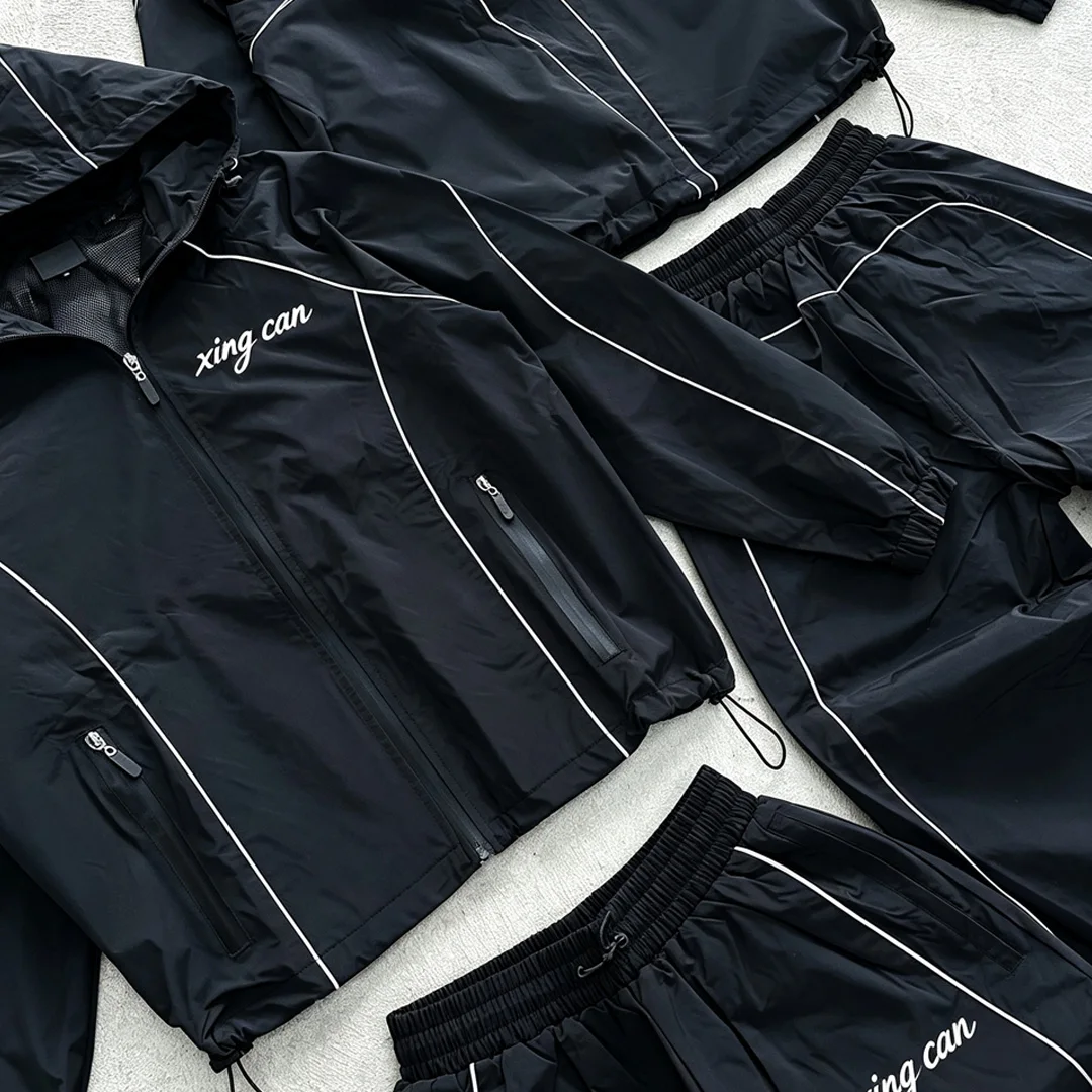 product streetwear factory custom nylon tracksuit with full reflective strips men screen print loose straight leg training suit oem-3