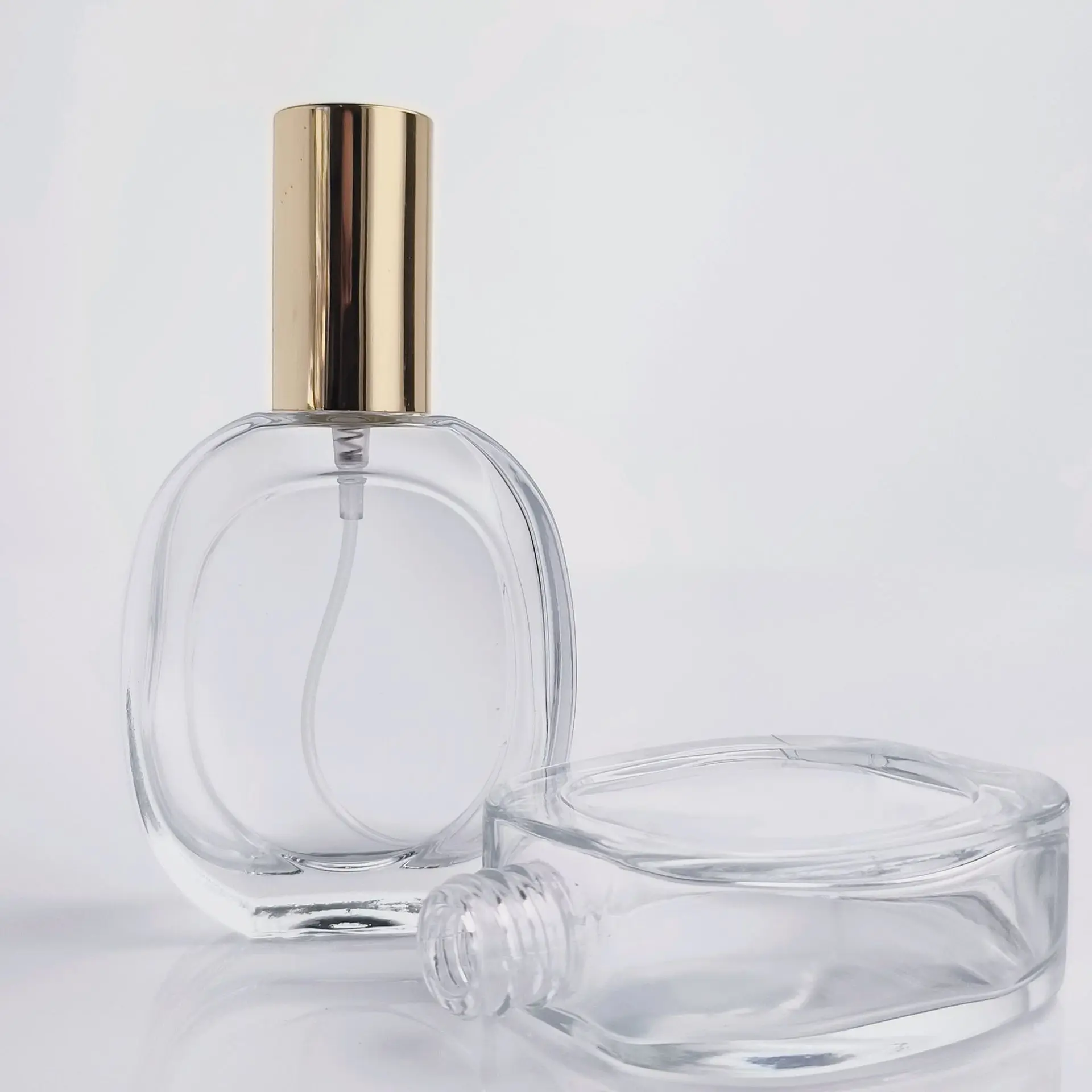 Wholesale 50ml Transparent Glass Perfume Bottle Round Flat Glass Perfume Bottle