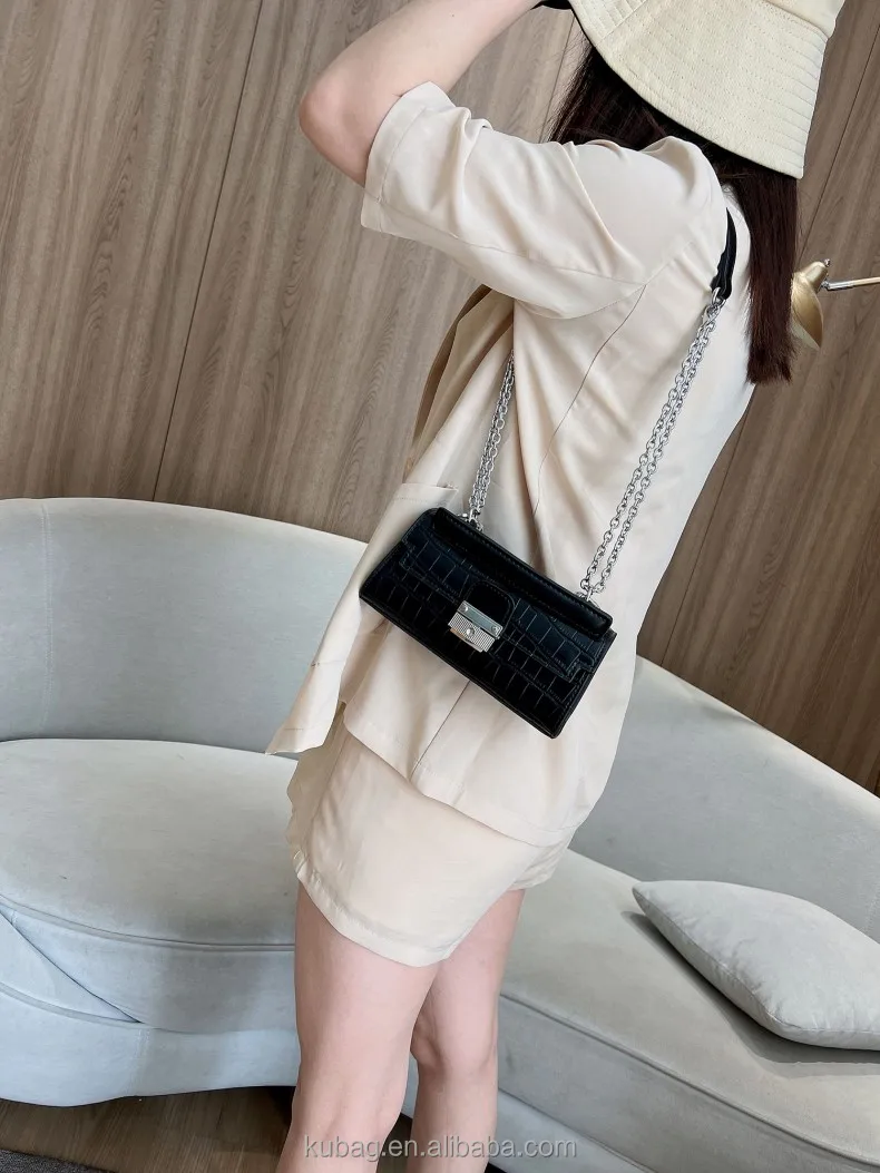 alligator embossed handbag