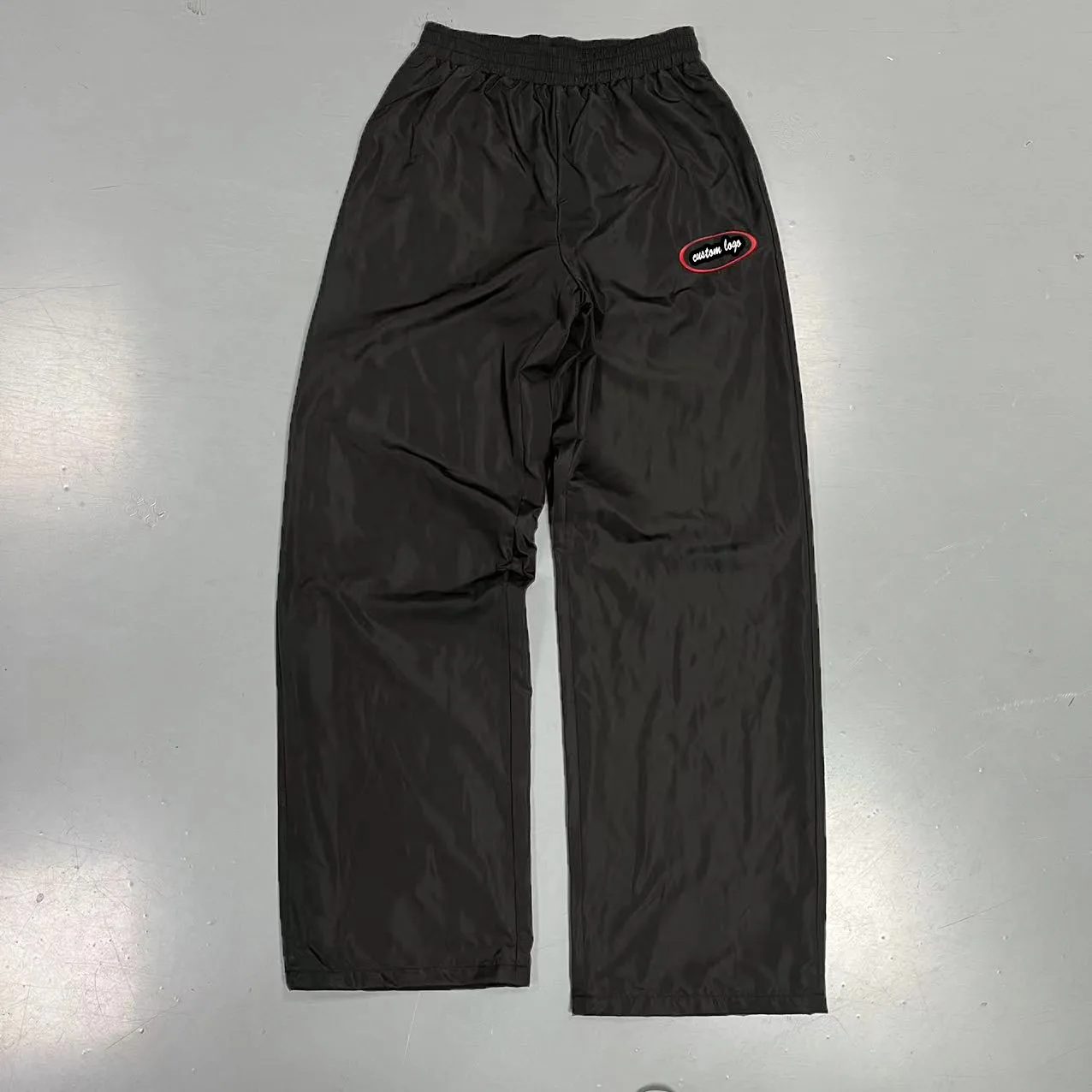 Dongguan Manufacturer Custom Casual Waterproof Outdoors Windbreaker Polyester Trousers Blank Embroidery Nylon Track Pants Men supplier