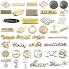 Metal Metal Clothing Accessoires Custom Sea Water Resist Brand Engraved Sewing Metal Logo Labels Tag For Swimwear
