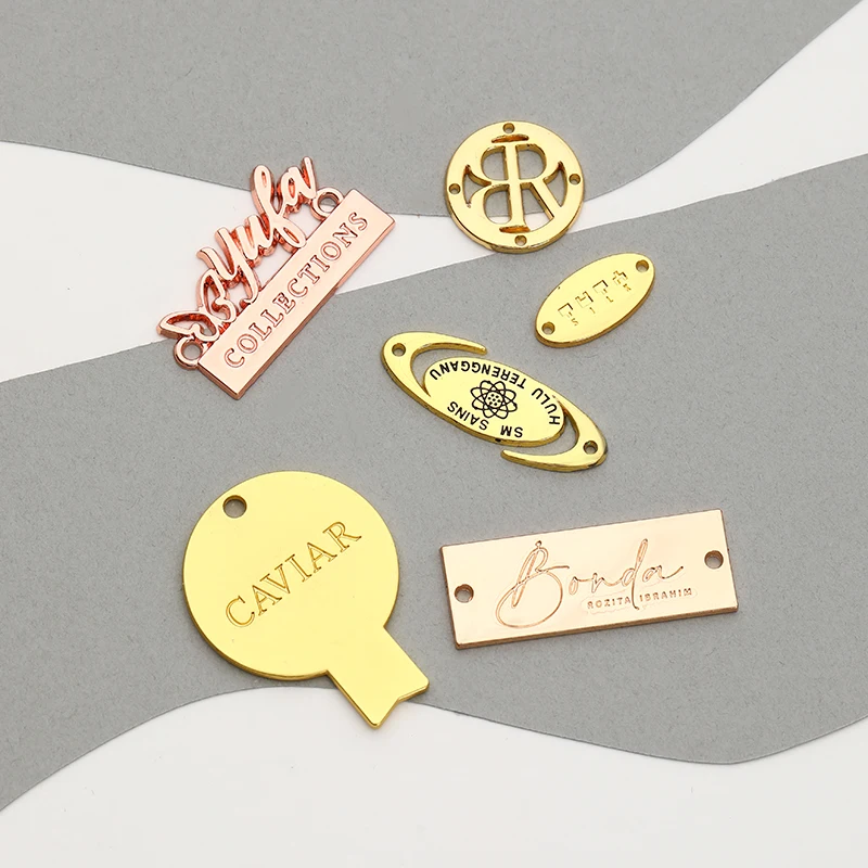 Custom Swimsuit Accessories Fancy Engraved Antique Brass Plating Alloy Sewing Metal Logo Labels for Swimwear for bag /clothing