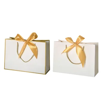 In stock bolsas de papel 2023 Wholesales White Custom Paper Bag Boutique Luxury Gold Foil Paper Shopping Bag With Ribbon Handle