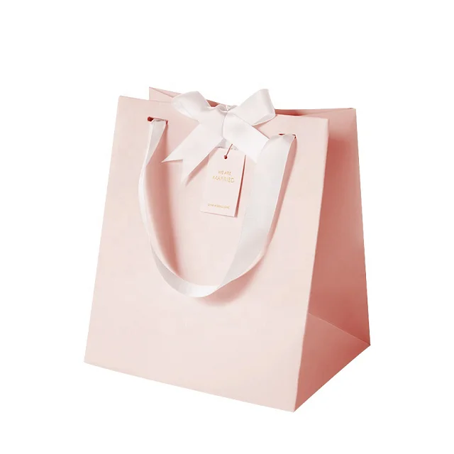 wholesale pink gift paper bag with handle with bow-knot