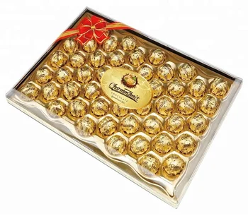 Presentation package golden foil wrapper wafer ball crispy biscuit covered with peanut compound sweet chocolate chip