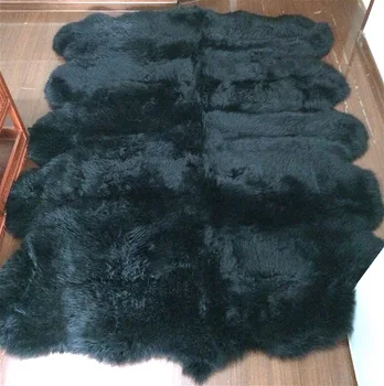 Large black sheepskin rugs for room decoration under table fireplace