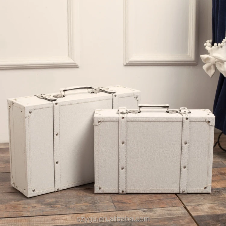 white leather suitcase