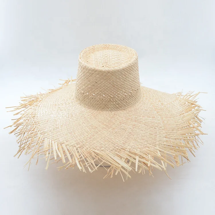 frayed floppy straw hat