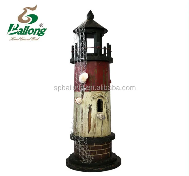 wood lighthouse with shell and fishing net