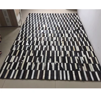 black and white patchwork cowhide rug with stripe design