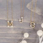 Gold Pearl Necklace Pearl New Necklace Gemnel 2021 New Designs A 18k Gold Plated Pearl Lvy Initial Pendant Necklace Women