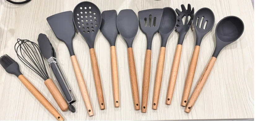 Multifunctional Silicone Kitchen Utensil Set with Wooden Handle Eco-Friendly Egg Beater Spatula Food Clip for Home Kitchen Use supplier