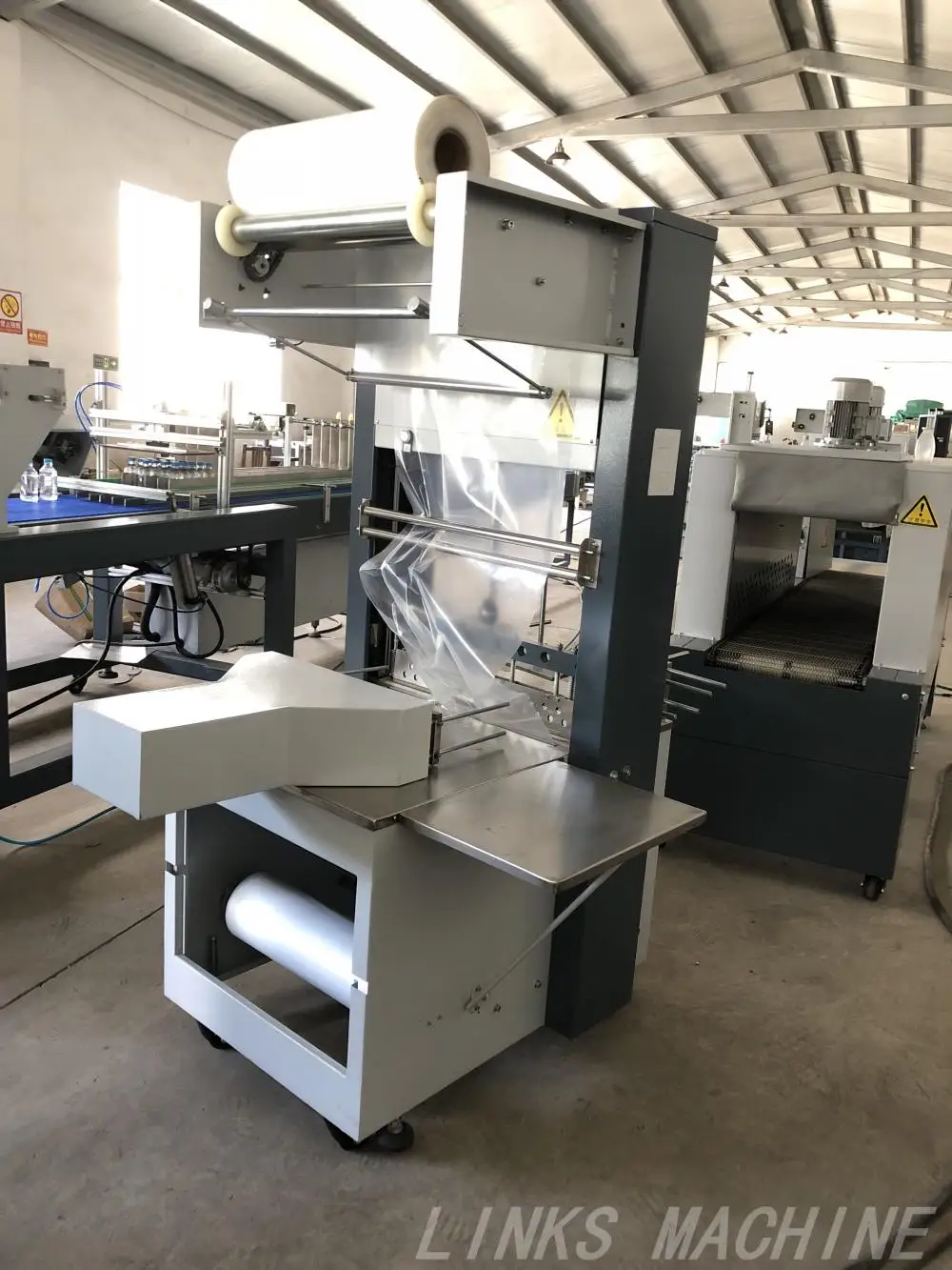 Shrink Wrap Machine Plastic Film Shrink Packaging Machine Semi Automatic Wrapping Machine factory