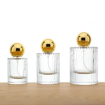 Free sample luxury 30 ml 50 ml 100 ml scent perfume glass bottle empty cylinder round spray botella perfume with gold cap