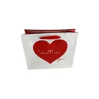 Offset Handle Custom Logo Offset Printing Heart Pattern Child Clothes Packing Paper Gift Bag With Ribbon Handle