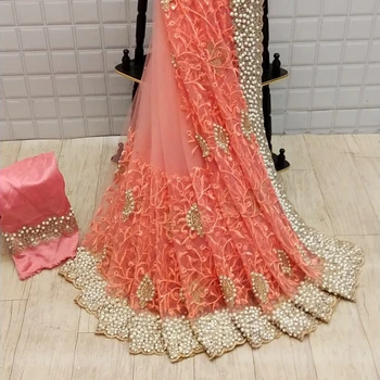 Party wear designer embroidered net silk flower design Indian ladies wear orange color saree with blouse piece pearl work sari