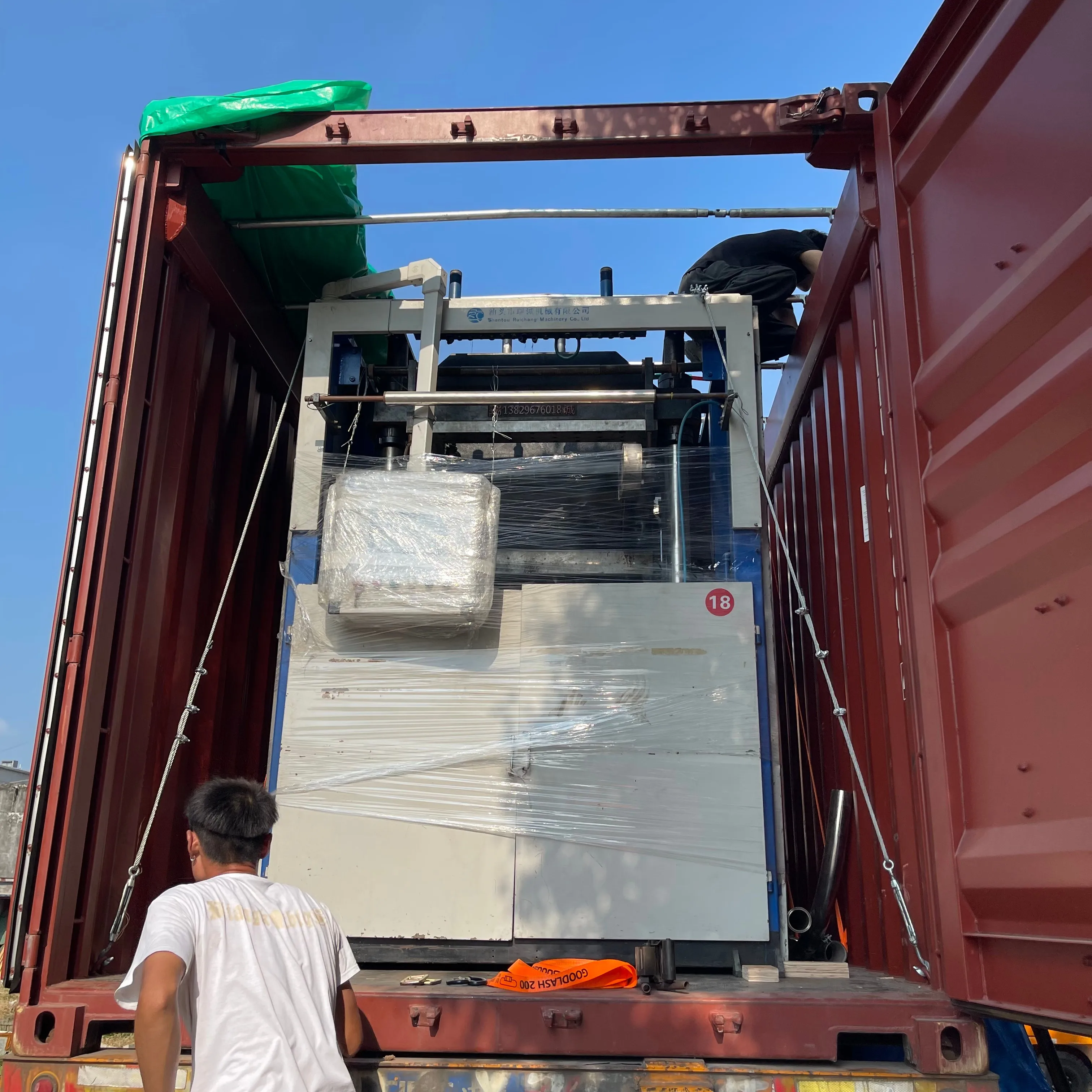 Cup making machine loading into shipping container