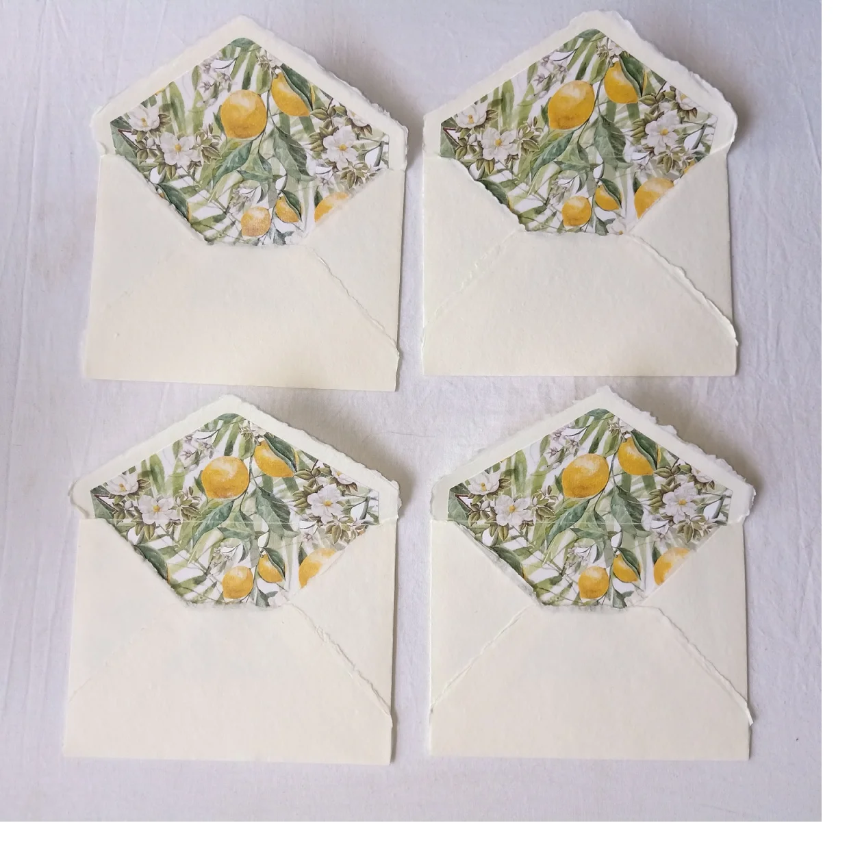 Custom Made Deckle Edged Paper Envelopes with Citrus Themed Liner Suitable for Wedding Stationers