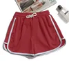 Red three-quarter pants