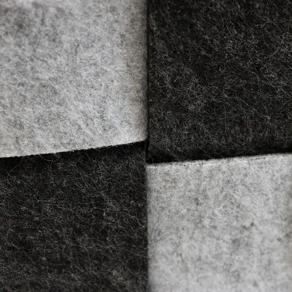 Close up of the felt checkerboard texture on the square felt storage basket