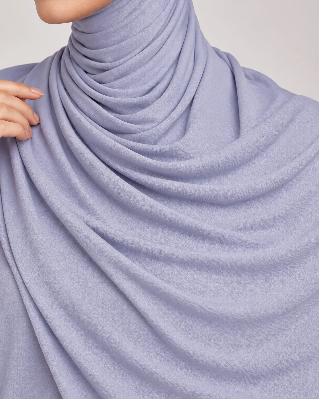 Bamboo jersey hijab fabric drape close-up — periwinkle blue soft fold detail