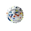 White base with blue, orange, and neon yellow dots