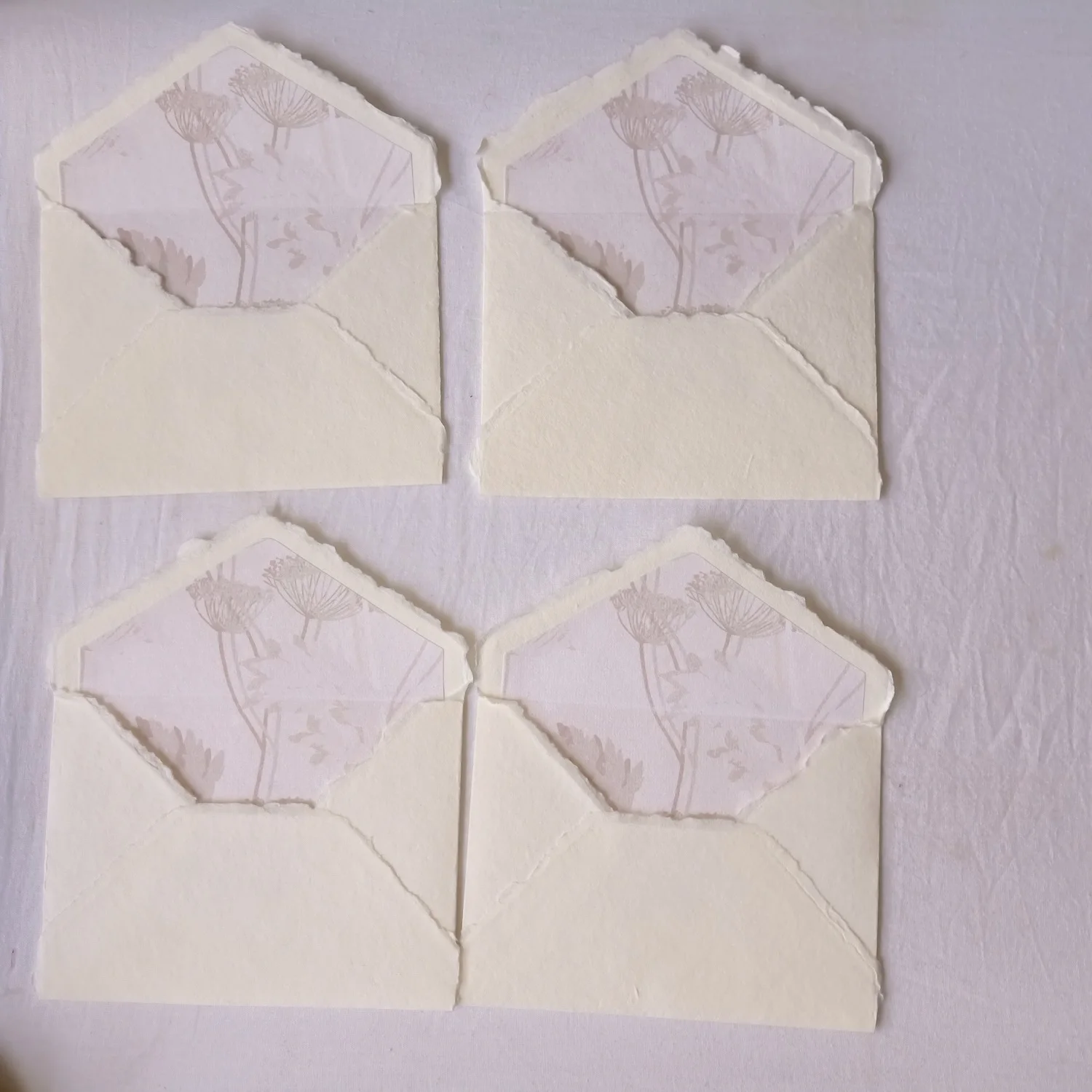 Custom Made Deckle Edged Paper Envelopes with Citrus Themed Liner Suitable for Wedding Stationers