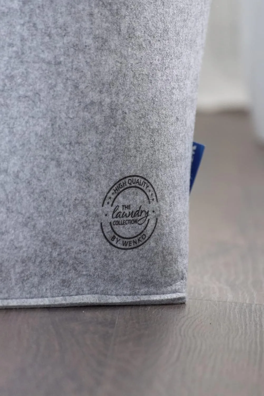 Close-up of polyester felt material and branded laundry hamper detail