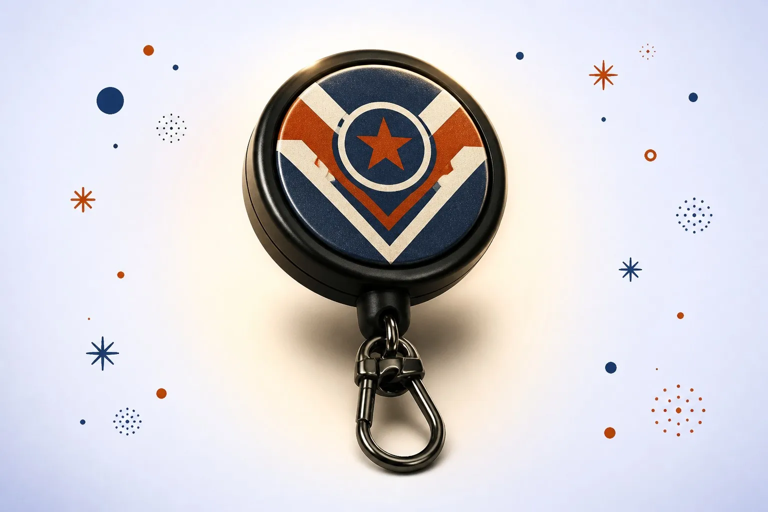 Badge retractable reel keychain hero shot — vintage varsity graphic on matte black reel with carabiner clip