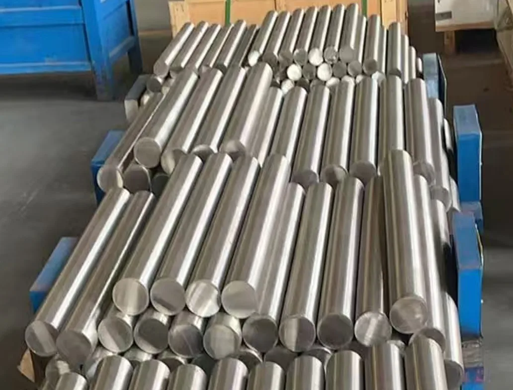Illustrative photograph of polished cylindrical metal stock for IN-738LC cast round bar; alloy identity not independently verified