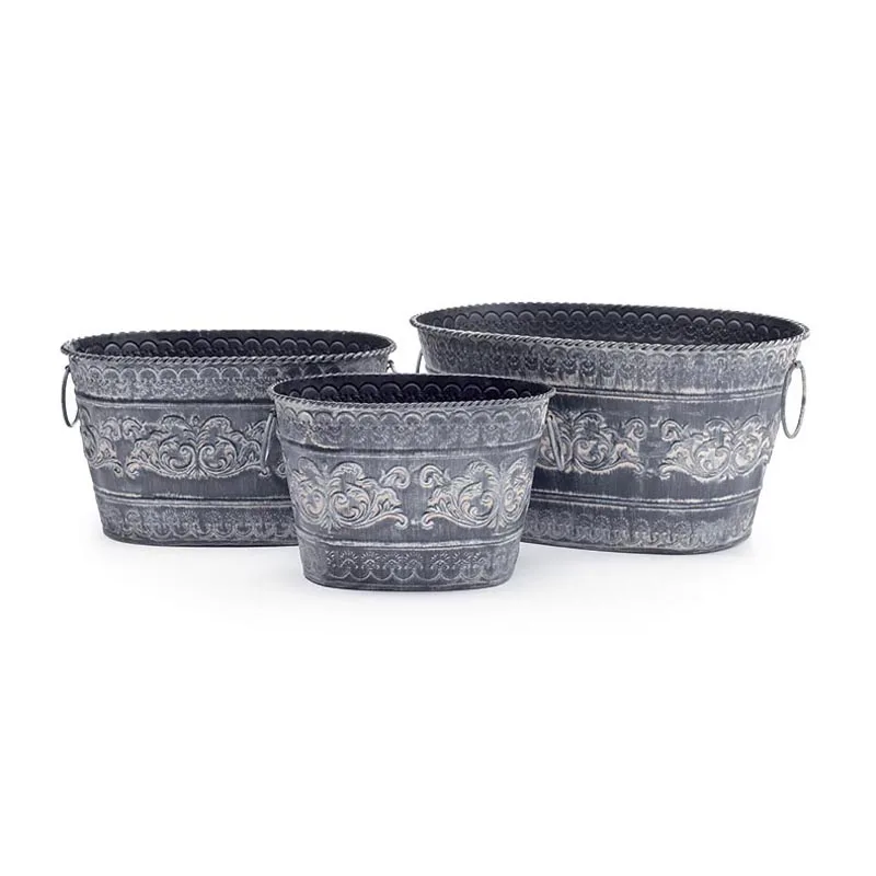 Set of 4 Embosed Metal Nested Tin Planters Accented With Medallion in the Center Each Planter Has Side Ring Handles in Wholesale