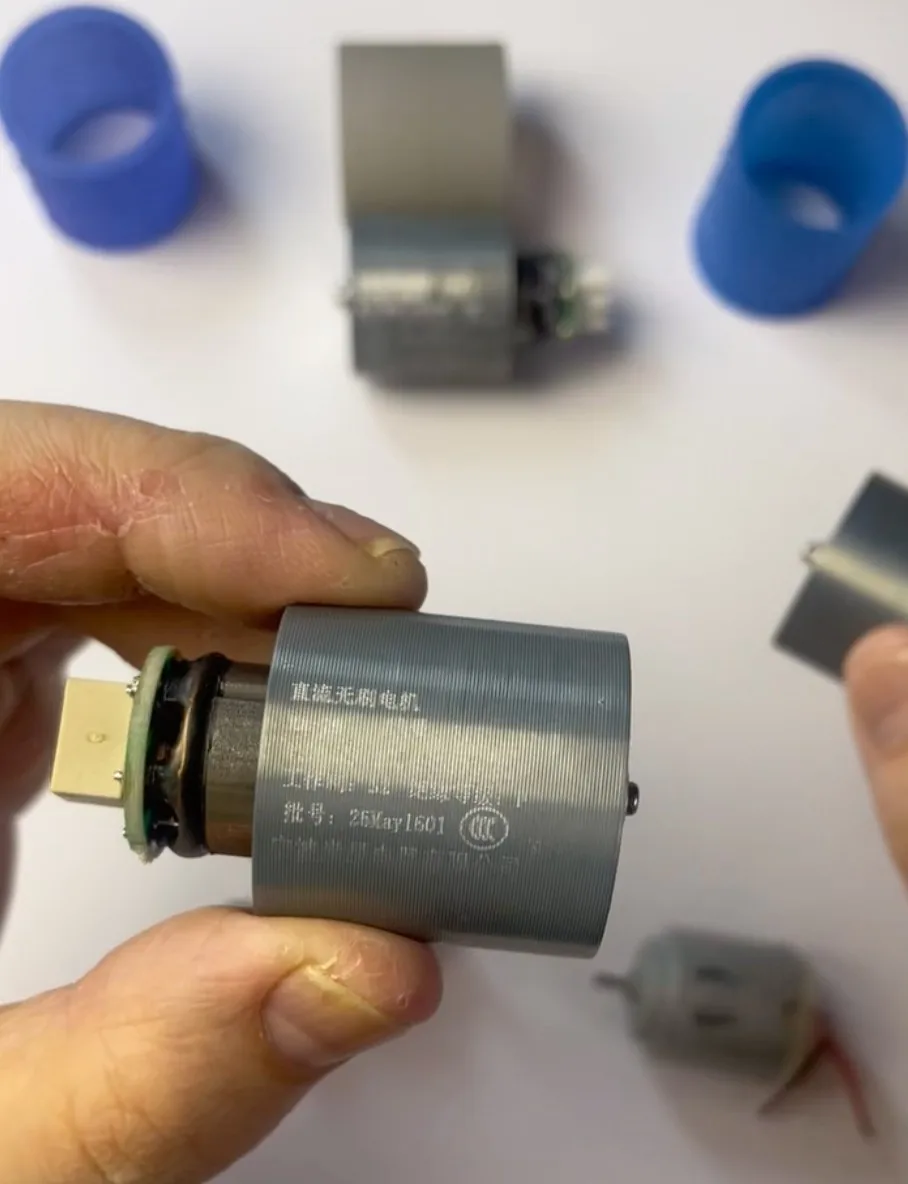 Brushless DC motor sample with clear laser-engraved markings, batch number, and CCC certification logo.