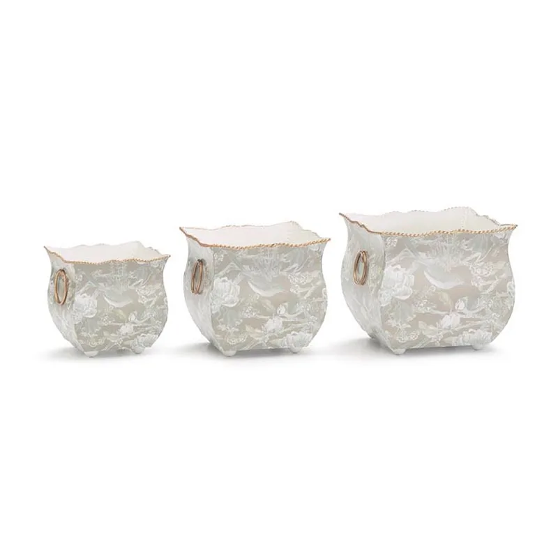Set of 4 Embosed Metal Nested Tin Planters Accented With Medallion in the Center Each Planter Has Side Ring Handles in Wholesale