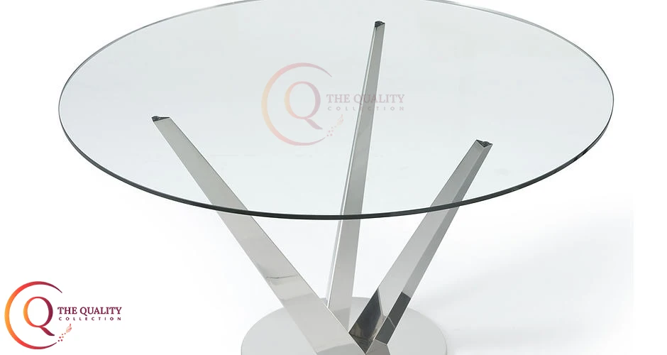 Modern Triangular Glass Table with Sleek Stainless Steel Legs a Unique Centerpiece for Contemporary Living Spaces.