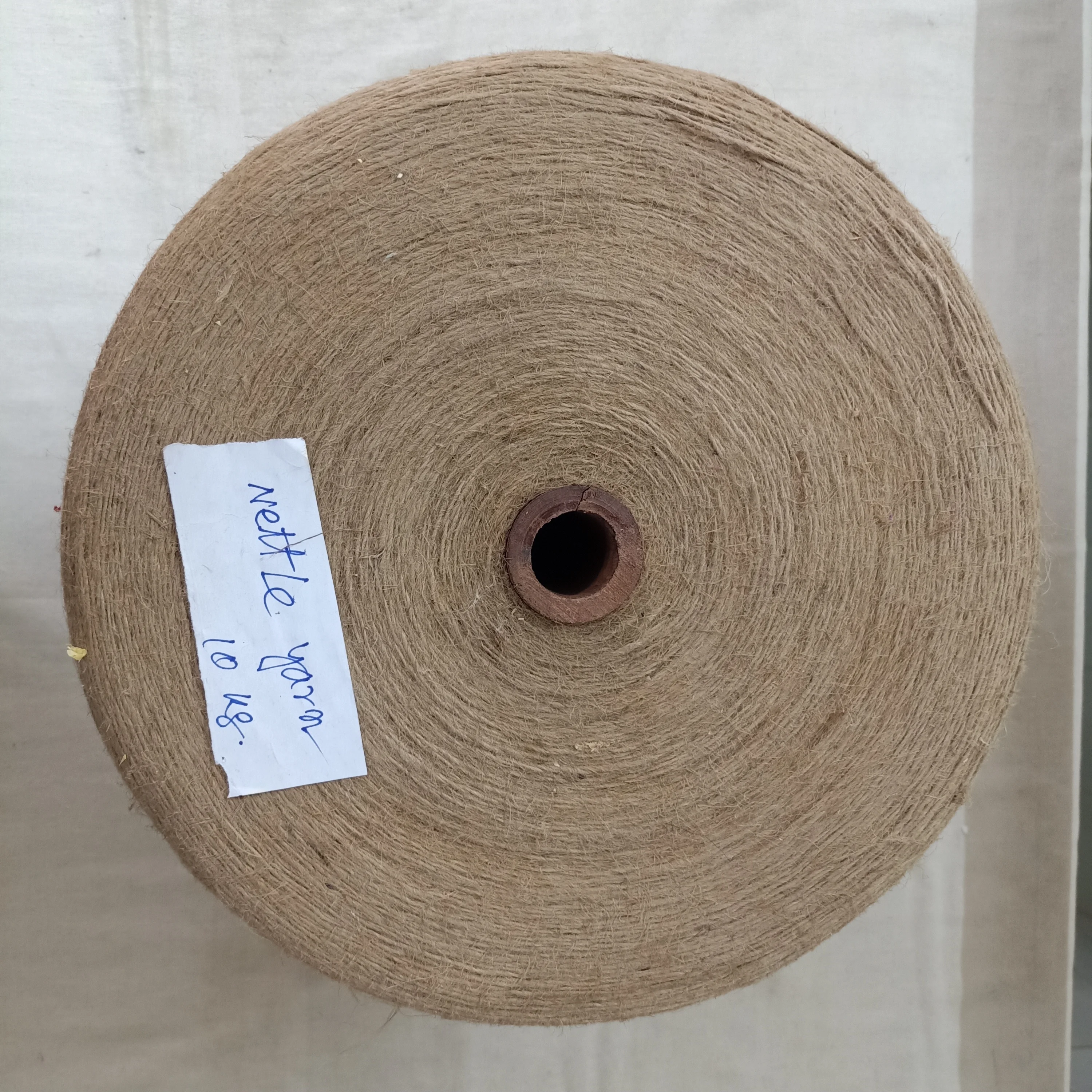 Large Sized Cones of Natural Nettle Fiber Yarns Poy Fdy Filament for Textile Spinning and Weaving Resale Purpose