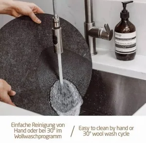 Care instruction image showing the round felt mat being hand washed