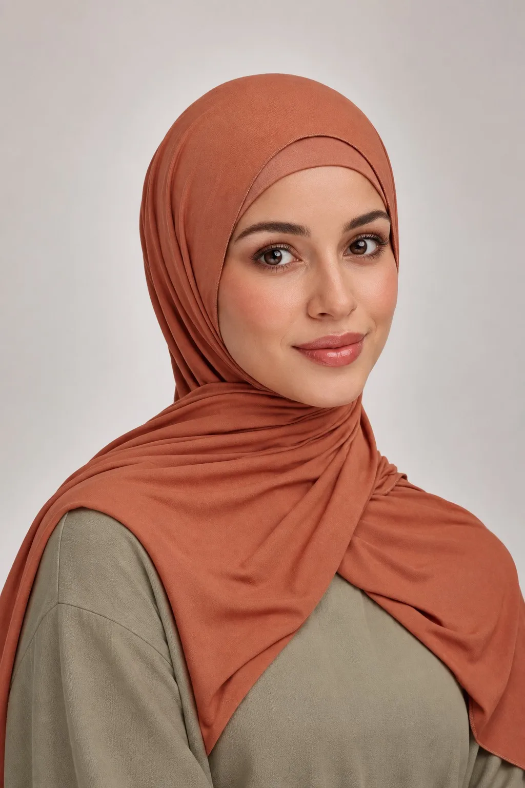 Wholesale bamboo jersey hijab set terracotta — model three-quarter view showing inner cap and drape