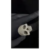 Anillo de diamantes con forma de cara