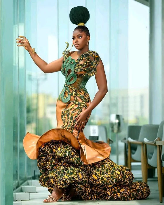 beaded ankara dress Ankara just got a whole lot sassier! , Meet our Anire Hand Beaded Ankara Dress, fit for royalty like you. , Purple and yellow tones, because youre a queen. And that cute flair? Twirl-worthy! , Price: