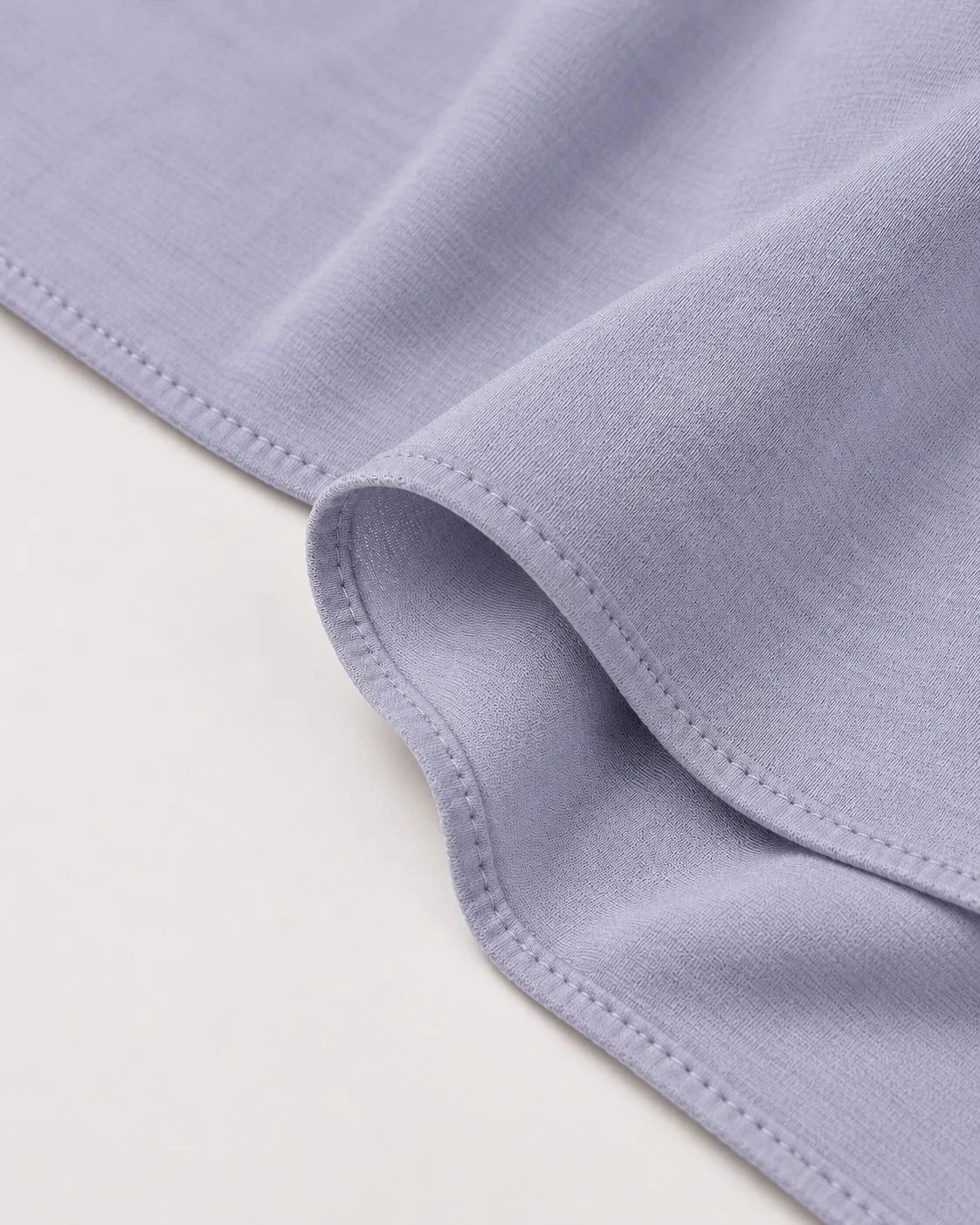 Custom bamboo jersey hijab set — hem edge and chain-stitch finish detail