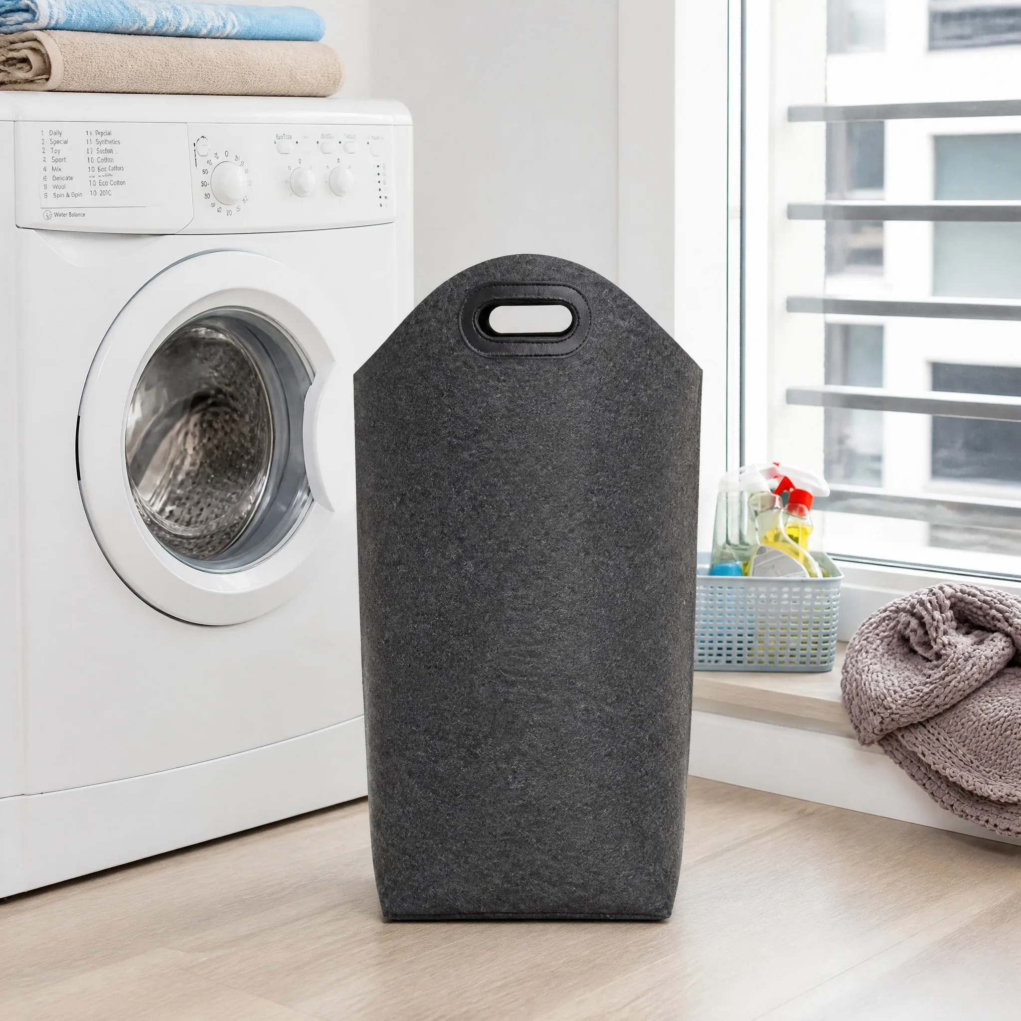 Felt hamper with laundry in a modern utility room